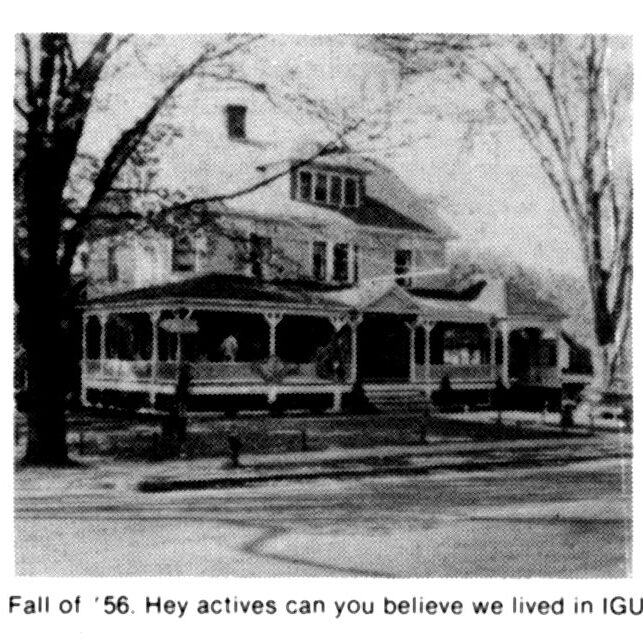 A black and white photo of an old house.